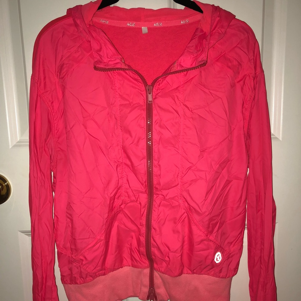 Neon pink light weight wind breaker